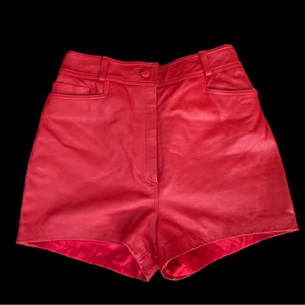 Vintage Julian K red leather high waisted shorts.